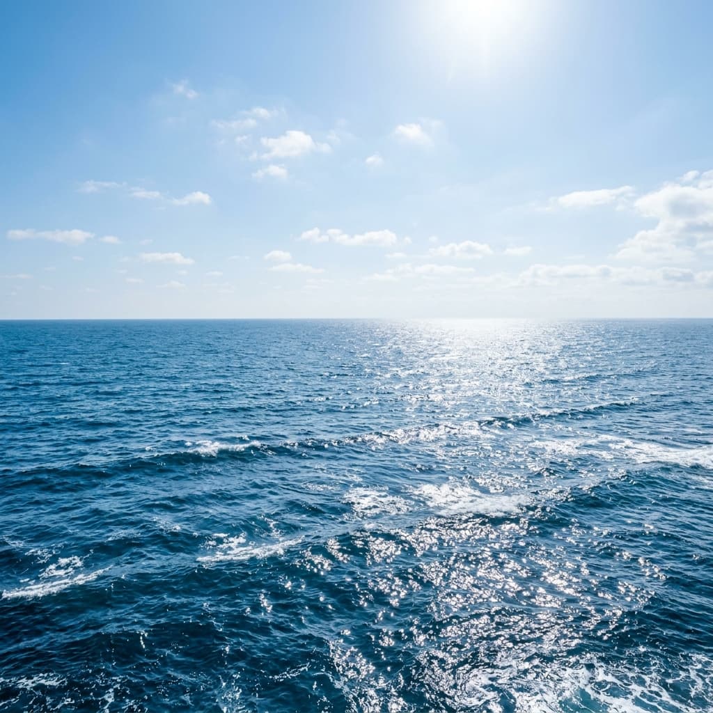 Ocean waves rolling under blue sky
